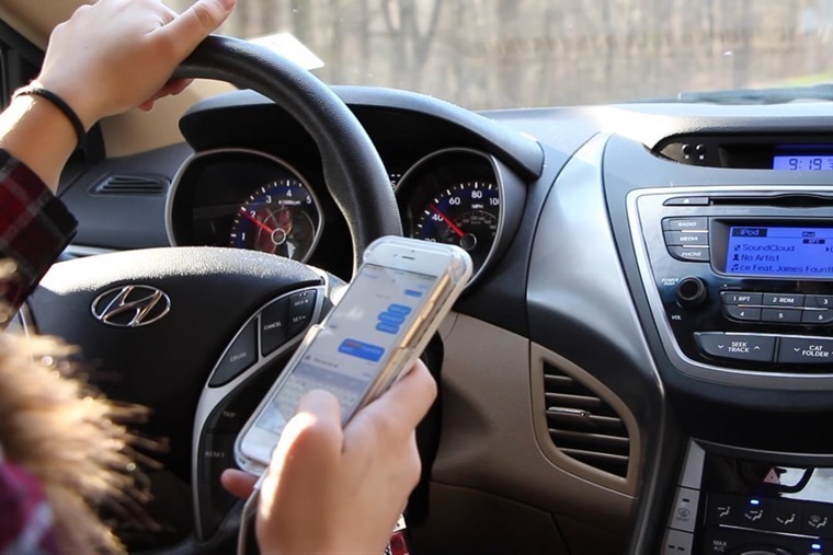 Mobile phone use behind the wheel