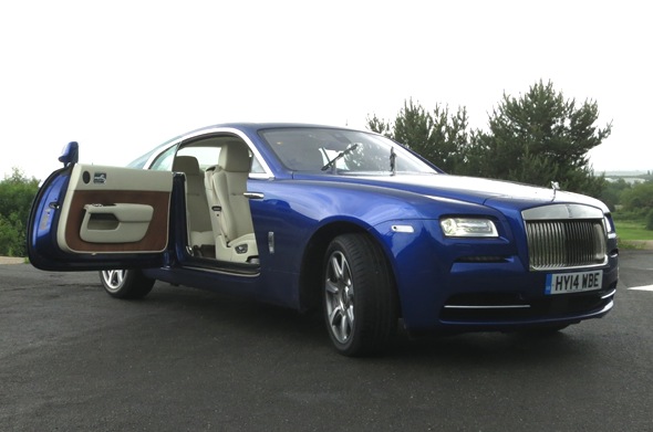 The Wraith's two doors open from the middle offering a view of the entire car’s interior, front and back