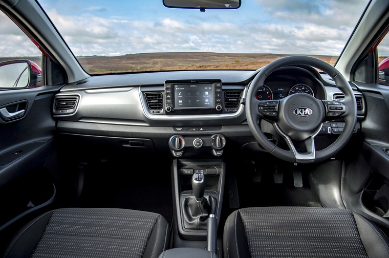 The interior is largely carried over from the smaller Rio hatchback.
