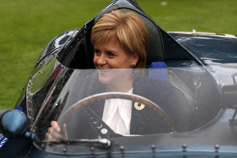 Nicola Sturgeon pictured in a classic car at the Concours d'Elegance, but she's looking to the future rather than the past.