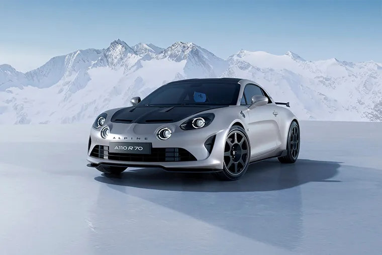 Alpine A110 R sports car front view in silver with mountain backdrop