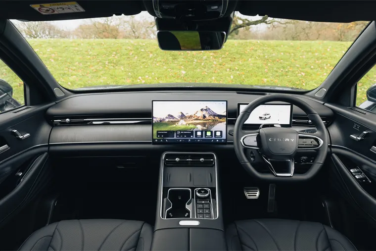Chery SUV interior featuring a modern dual-screen dashboard, leather seating, digital controls and a minimalist premium cabin layout.