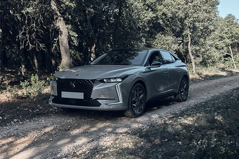 DS 4 premium hatchback front view driving on forest track