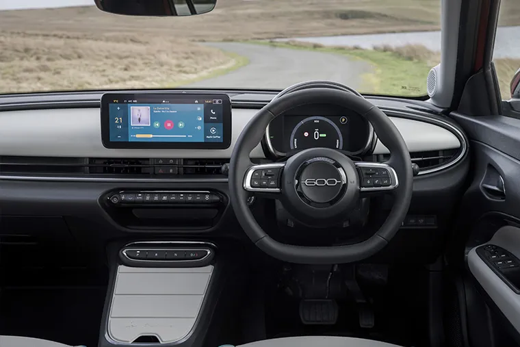 Interior view of Fiat 600e electric SUV featuring digital cockpit.