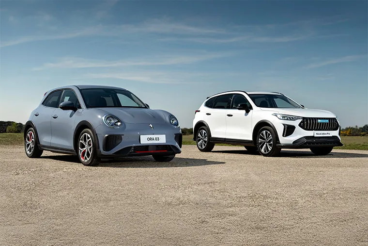Grey Ora 03 electric hatchback next to white Haval Jolion Pro SUV on open road