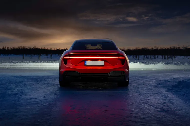 Lotus Emeya electric sports saloon rear view with LED light bar at night