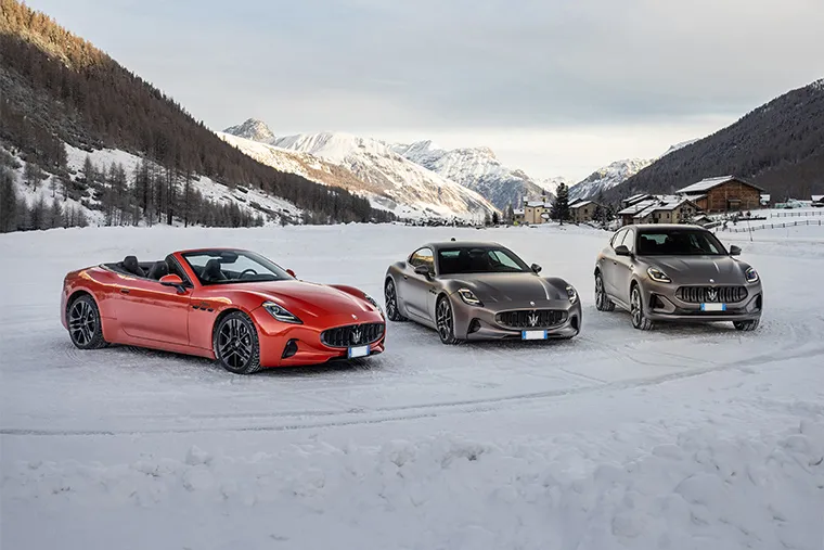 Maserati GranCabrio, GranTurismo, and Grecale parked on snow in the Italian Alps