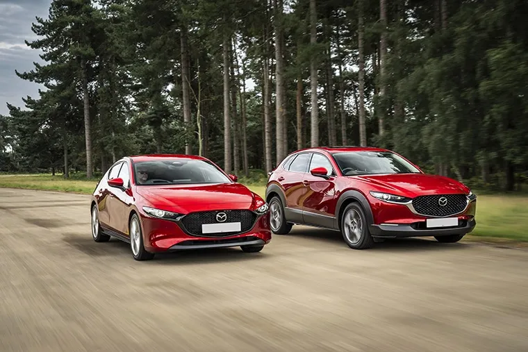 Two red Mazda models