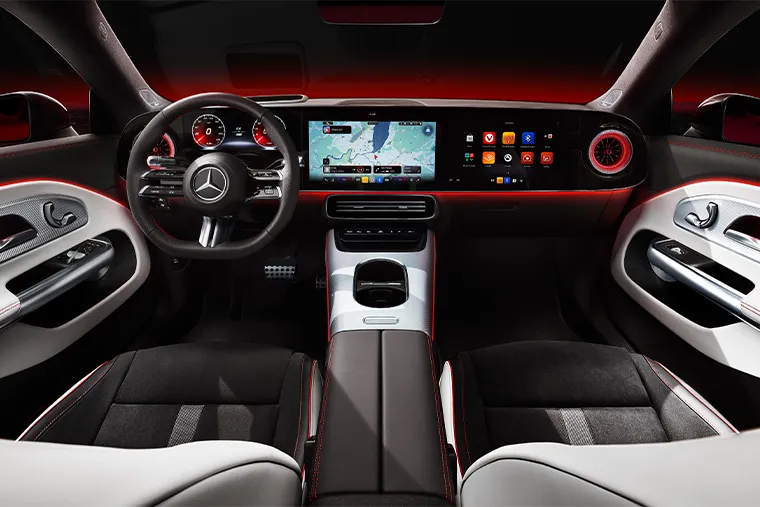 Mercedes-Benz interior showcasing dual widescreen digital displays, ambient lighting and premium leather-trimmed cabin