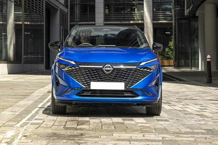 Frontal view of Nissan Qashqai e-POWER in urban business district