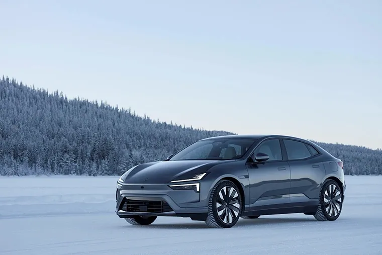 Polestar 4 electric coupe-SUV in blue parked in scenic countryside