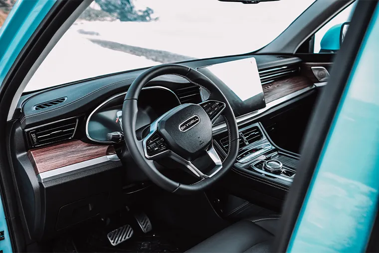 Skywell electric SUV interior featuring a minimalist dashboard with wood trim, large touchscreen display, and multifunction steering wheel