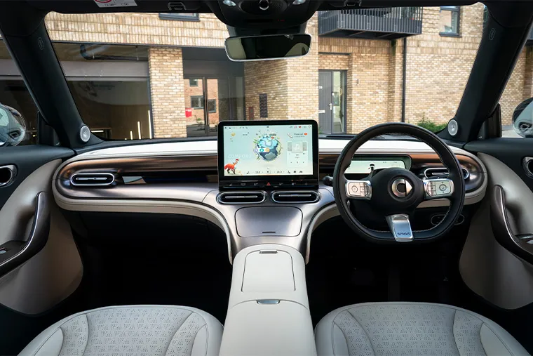 Smart #1 interior showing modern dashboard with large central touchscreen and digital driver display