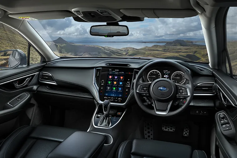 Interior view of 2025 Subaru Outback with digital infotainment screen and steering wheel