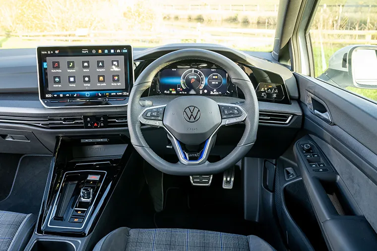 Volkswagen digital dashboard and touchscreen infotainment system showing modern interior tech features.